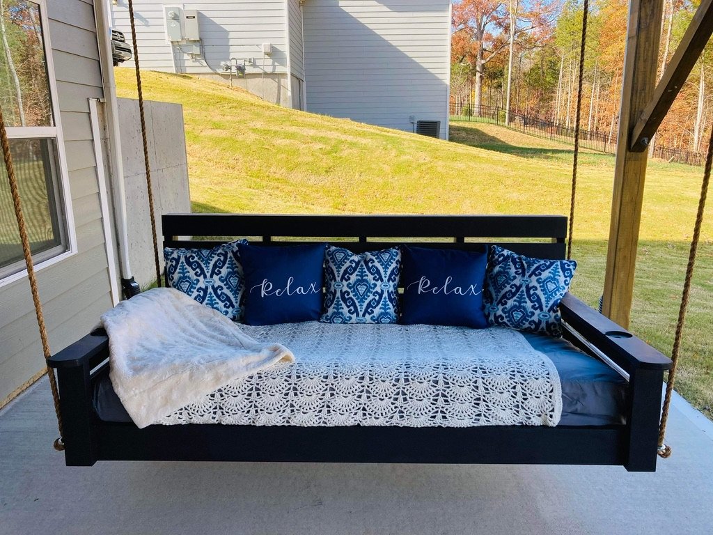 Blue and black swing with relax pillows