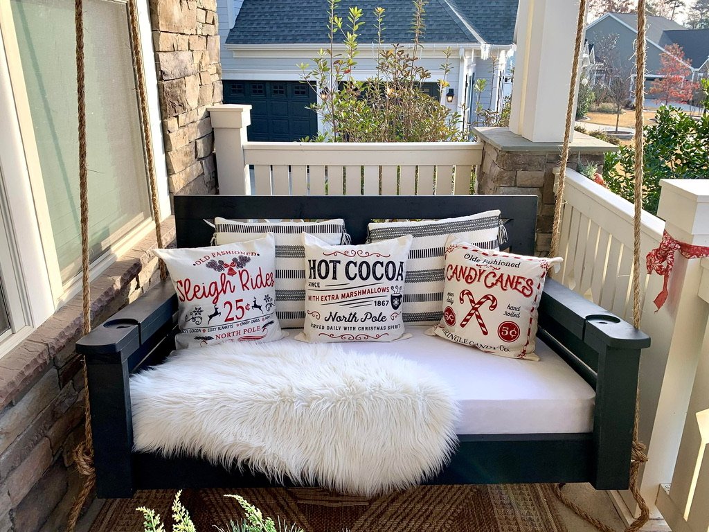 Holiday swing with candy cane pillows