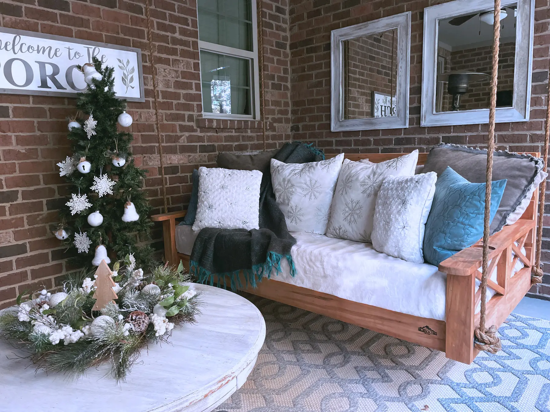 Styled Live Elevated bed swing on a covered porch